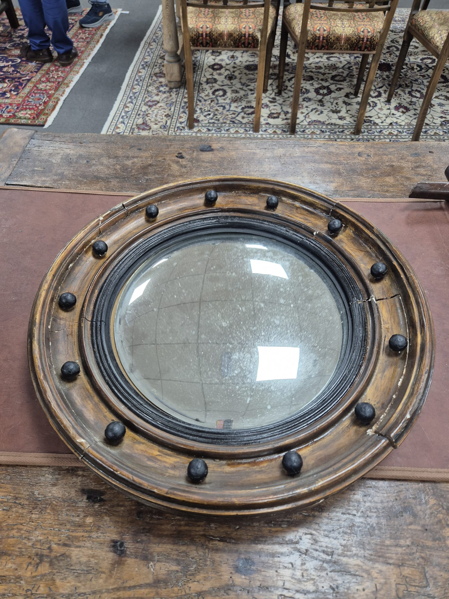 A 19th century gilt convex wall mirror, 47cm diameter. Condition - frame needs regluing